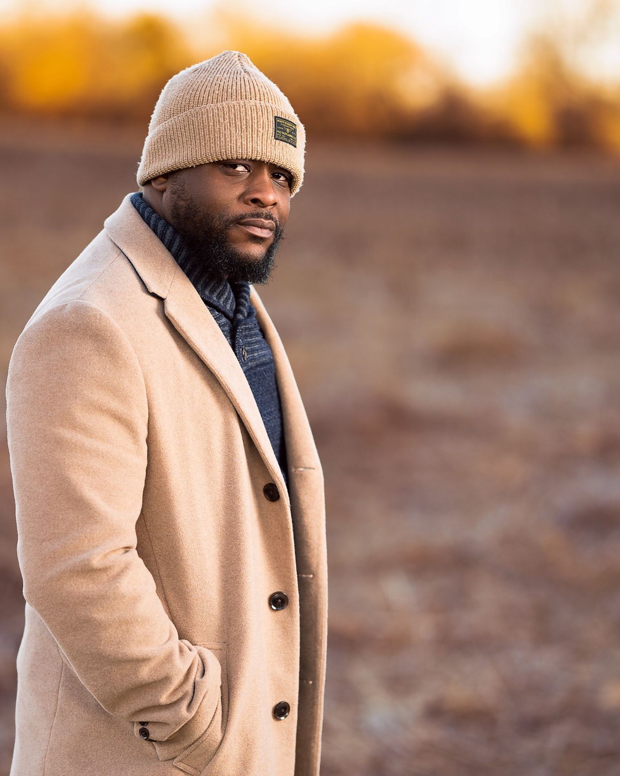 A knitted beanie with a camel coat