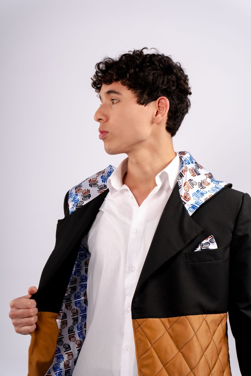 A jacket held open to reveal its contrasting lining