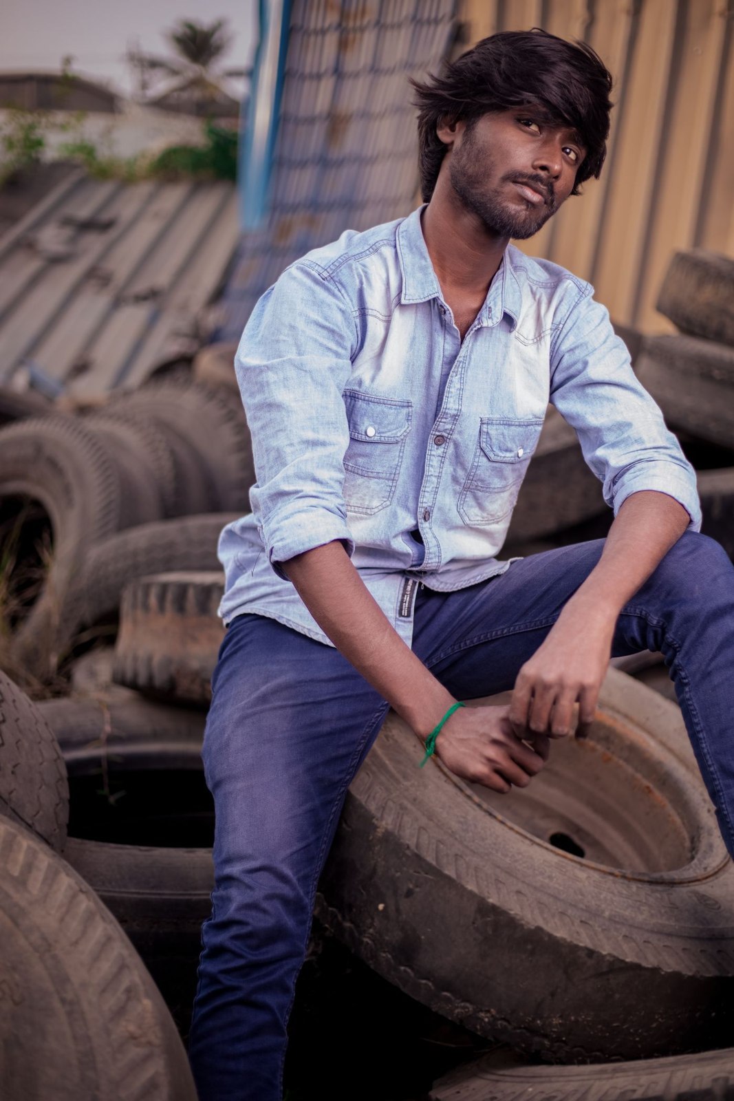 A pale denim shirt with dark non-denim trousers