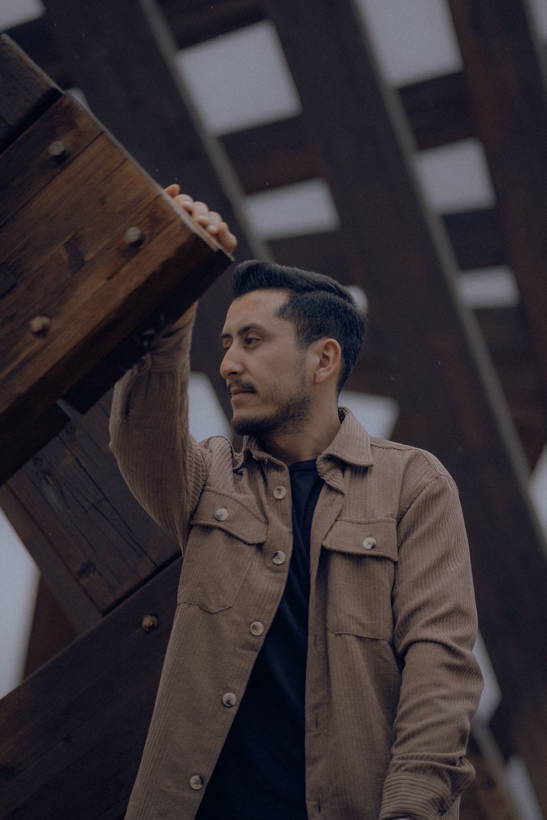 A pocketed field jacket over dark layers