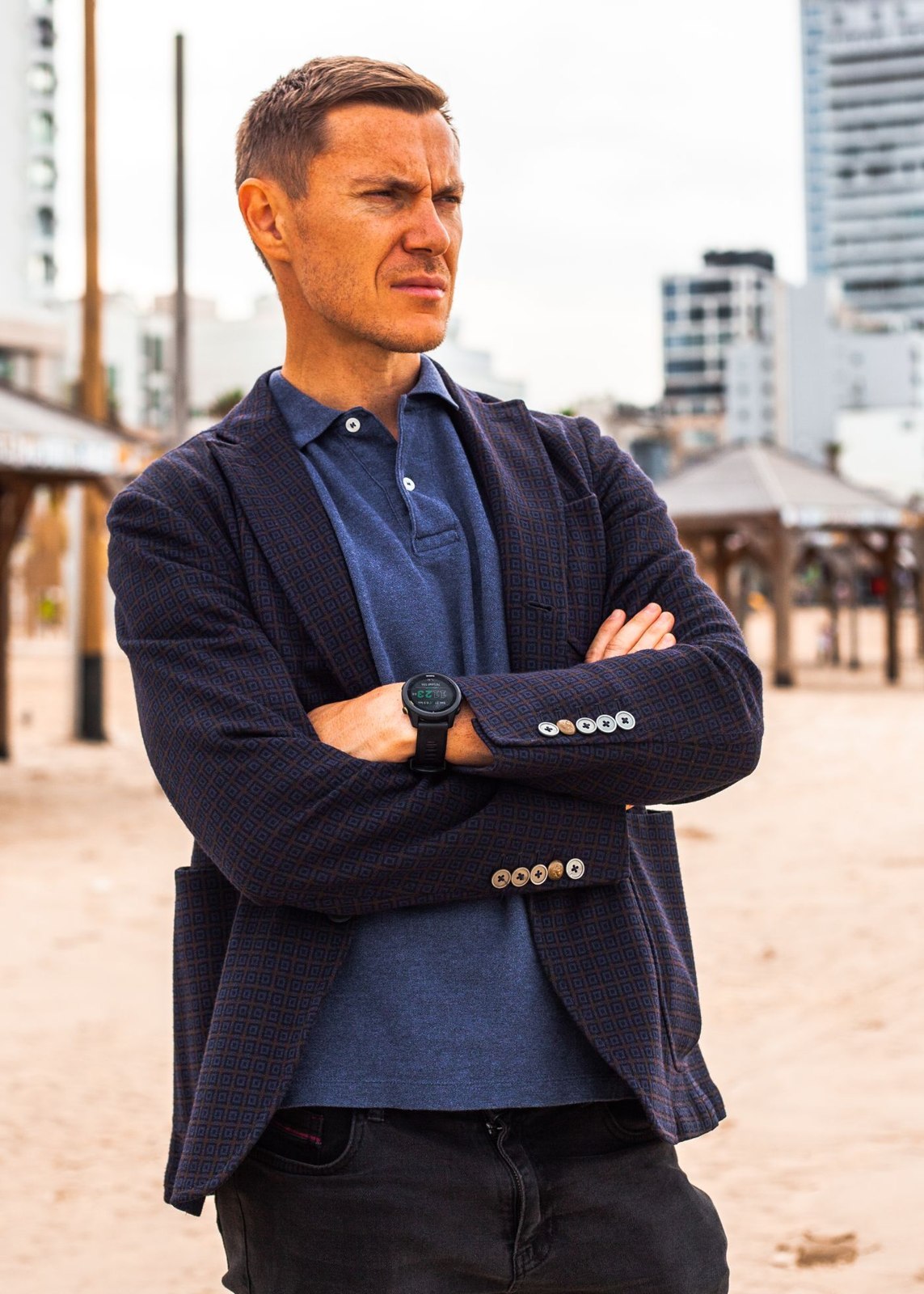 A dark blazer and polo shirt outdoors