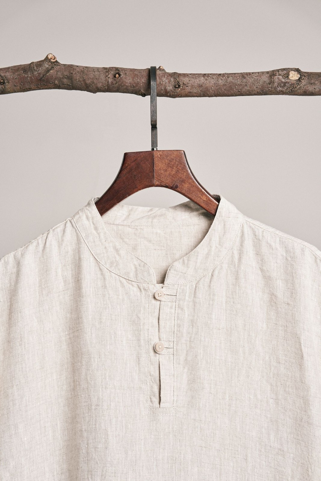 Light linen shirt on a wooden hanger