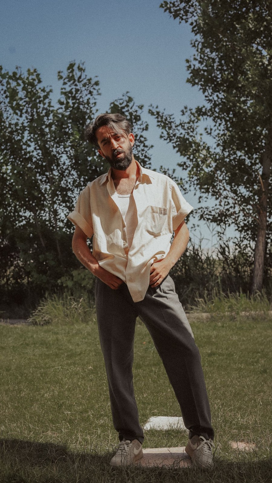 A light shirt with relaxed dark trousers