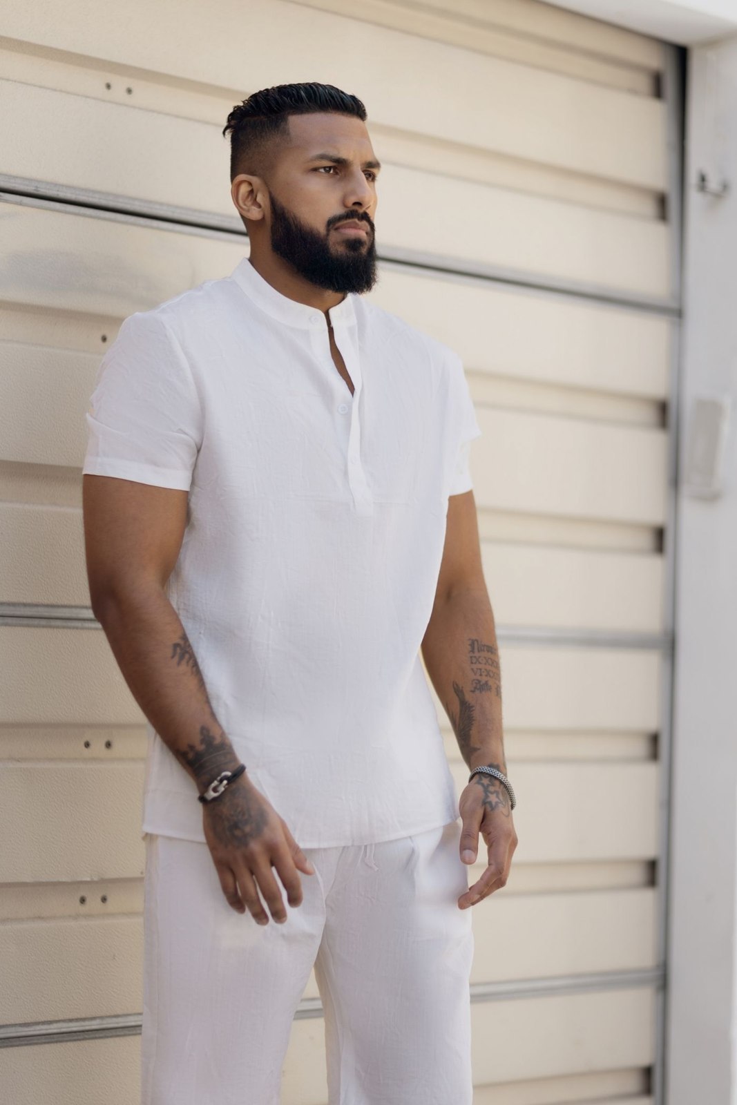 A white polo and white trousers outdoors