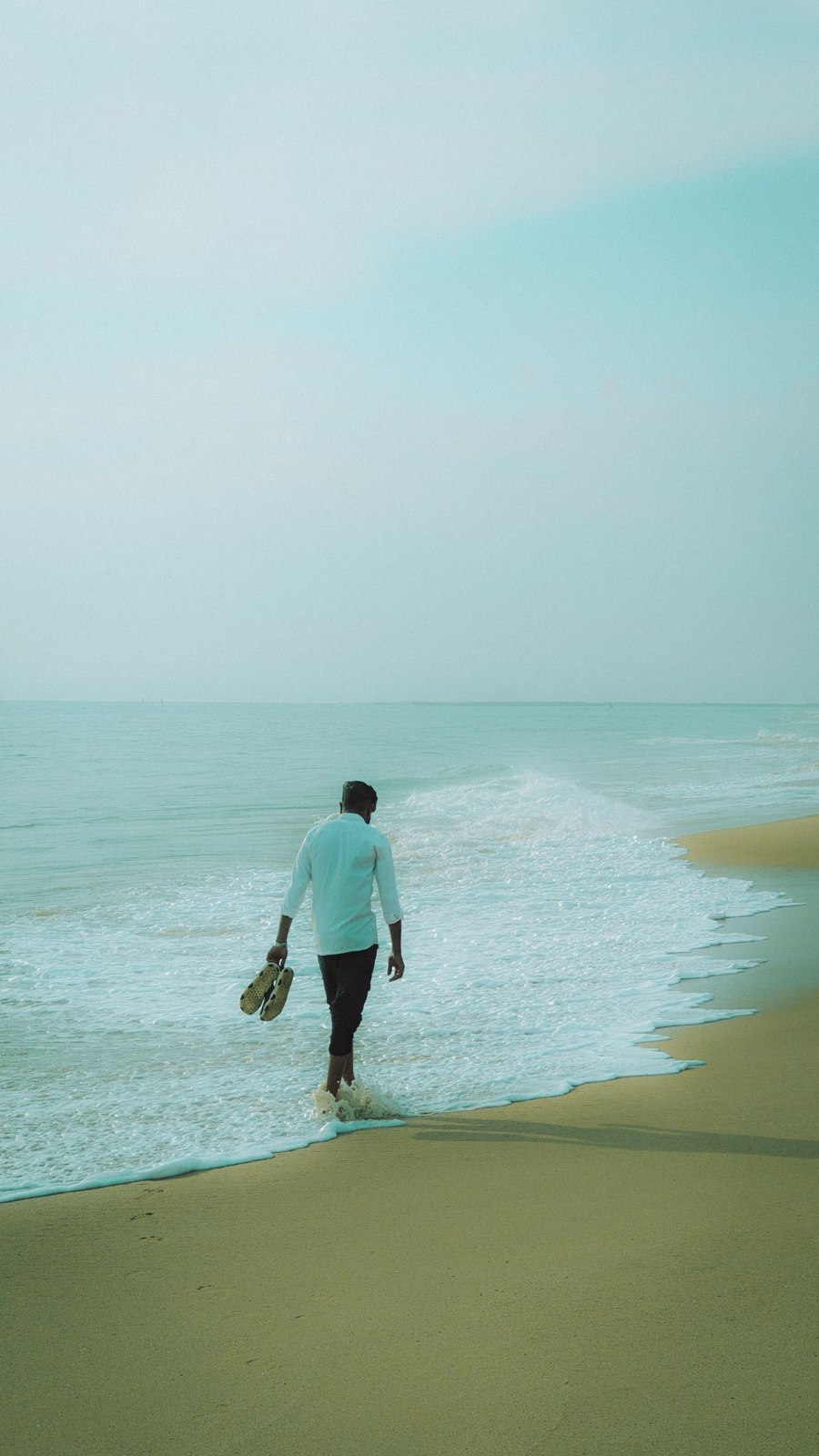 A long-sleeved shirt and trousers at the coast