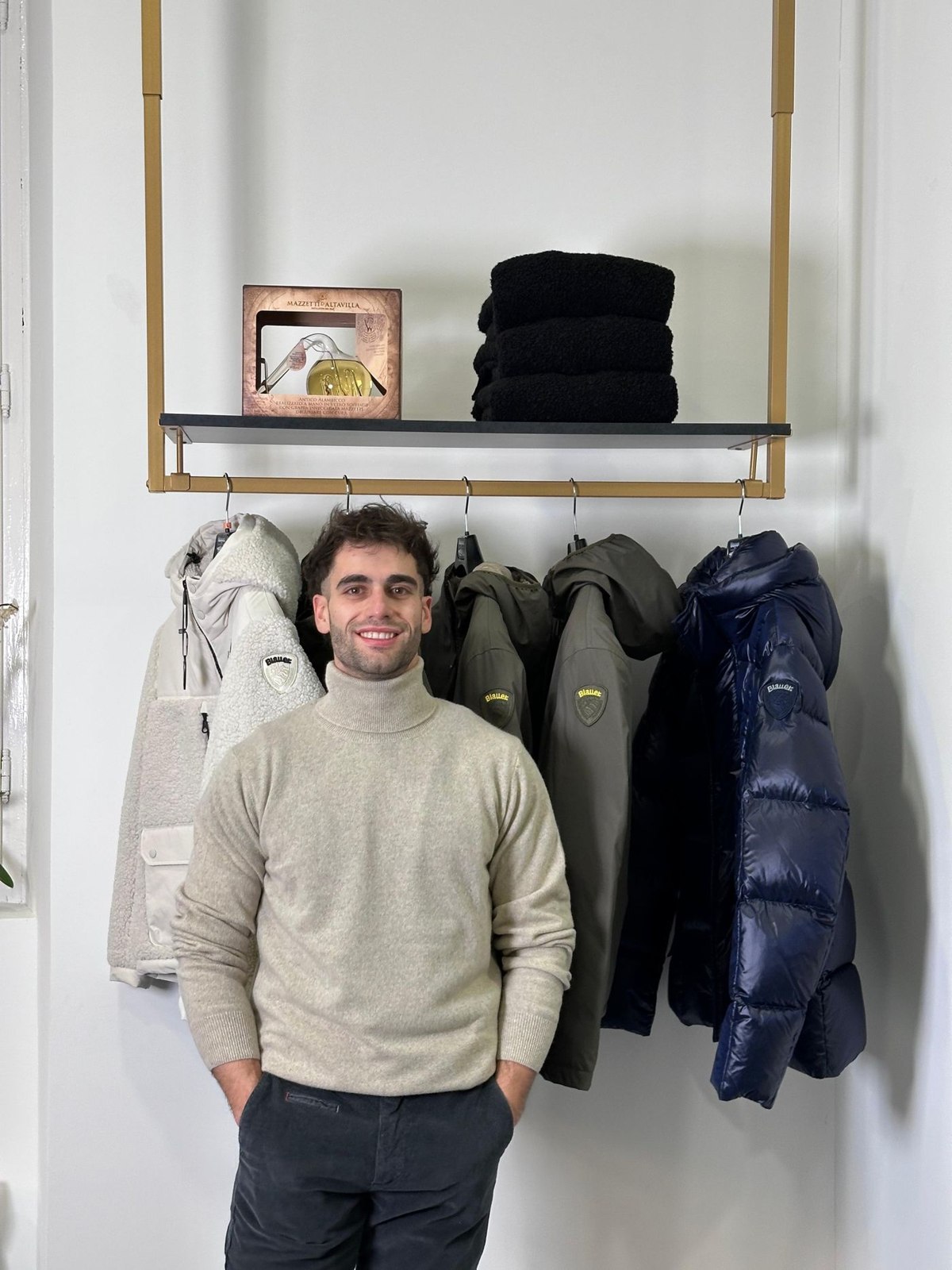 A chunky roll-neck next to winter coats