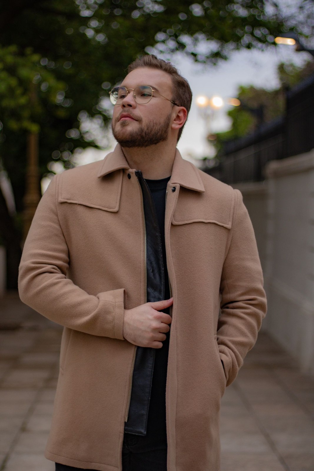 Camel coat over a dark shirt