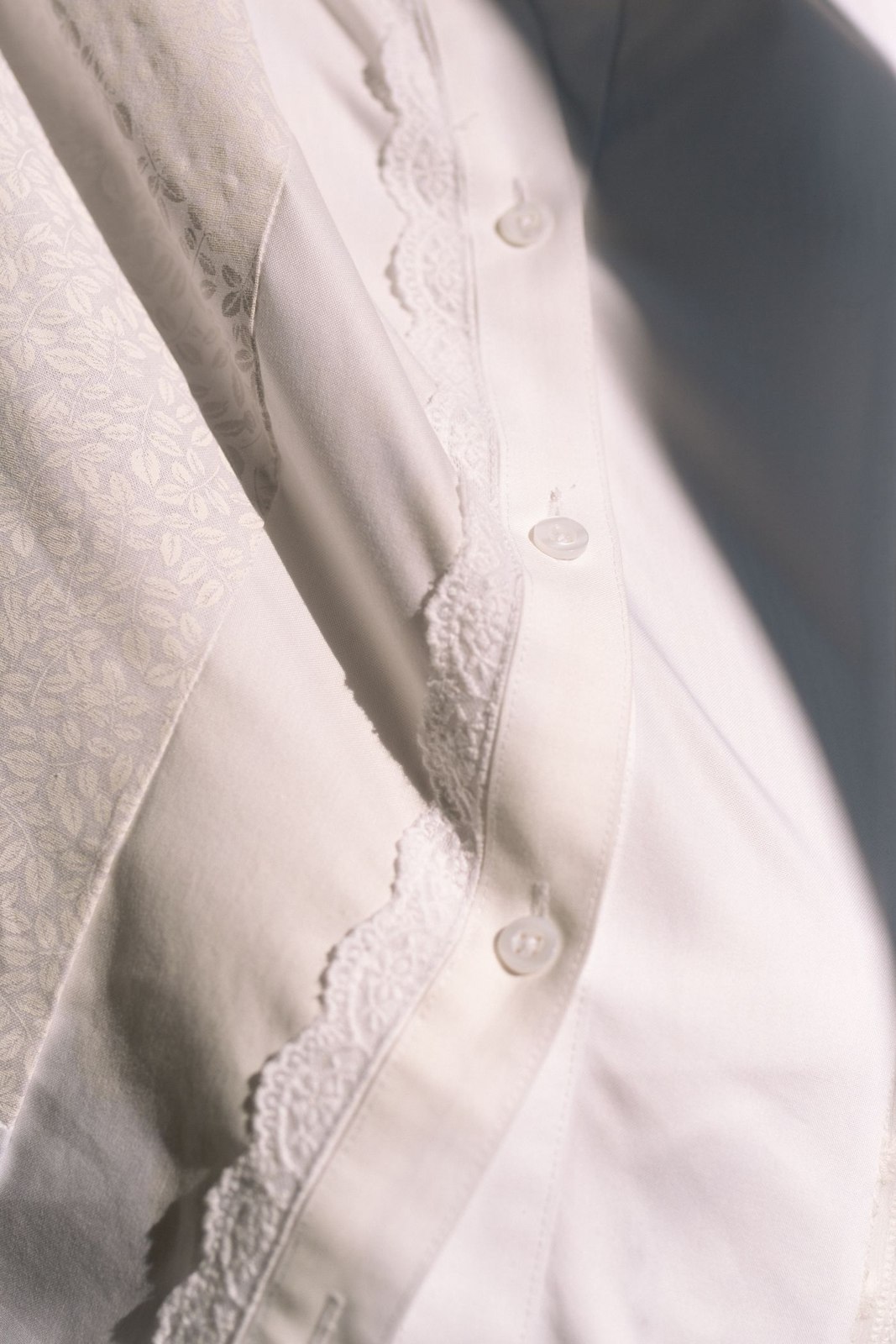 Light shining across a pale shirt fabric