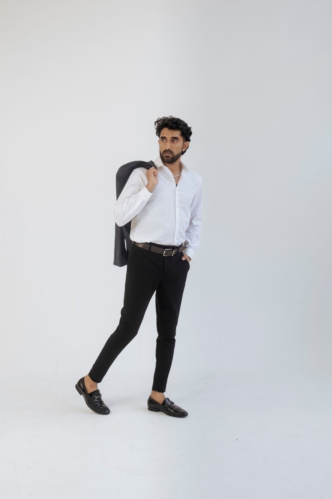 Dark trousers with a white shirt