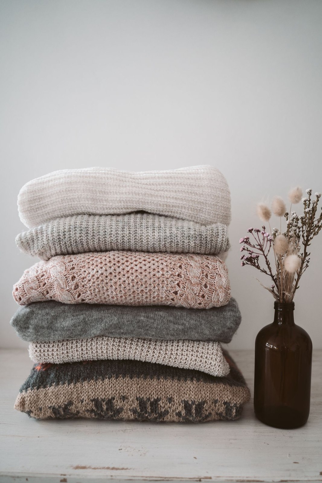A stack of folded knitwear