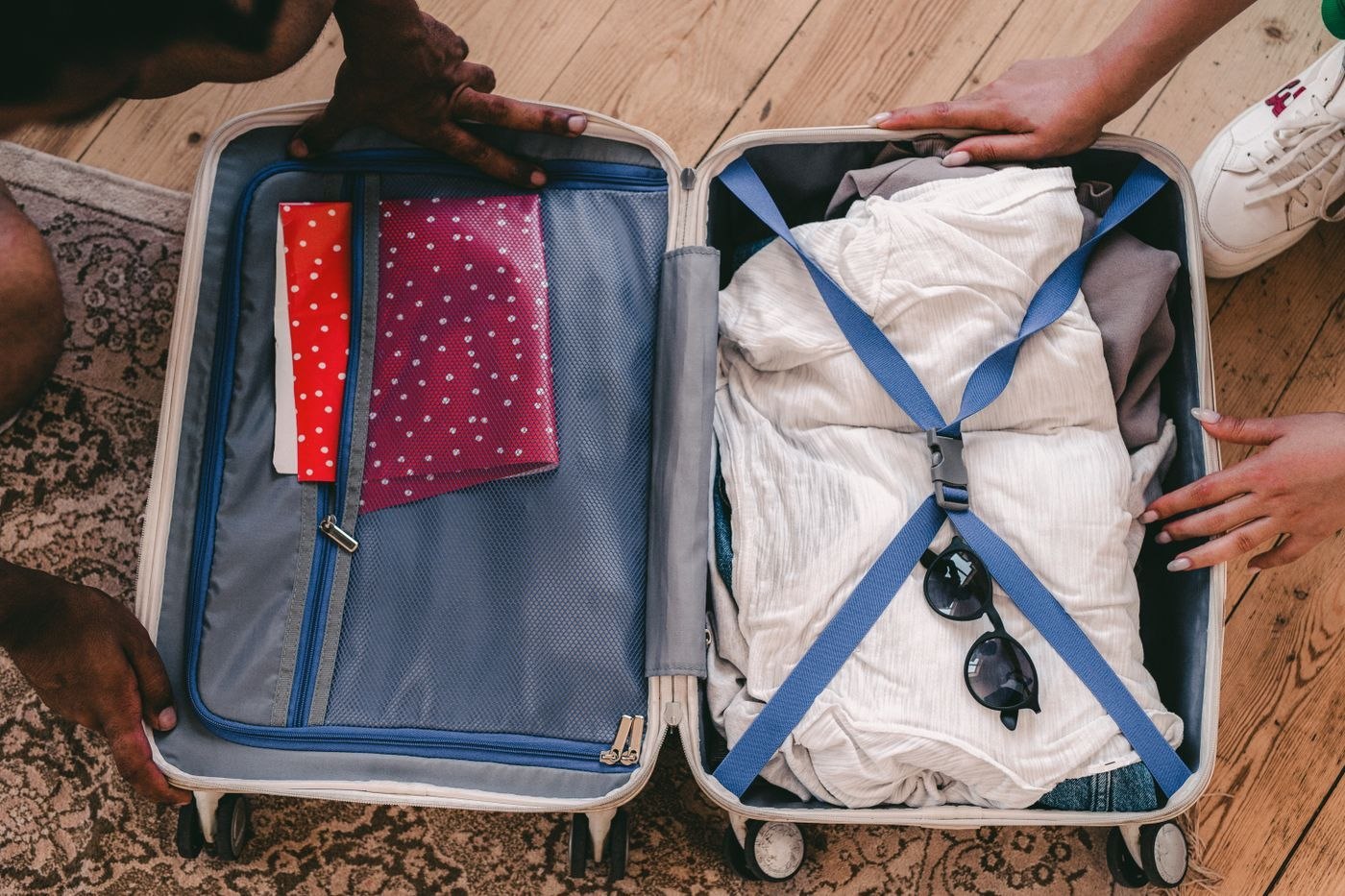 A shirt neatly folded into an open suitcase