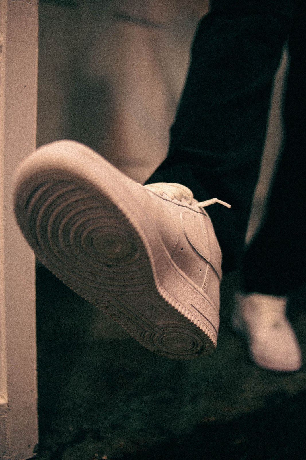 A close view of a white trainer and its sole