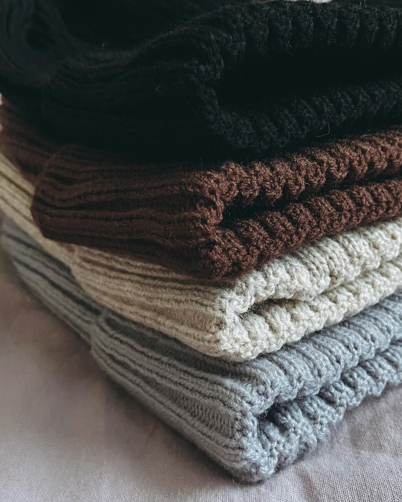 Textured knitwear folded in a stack