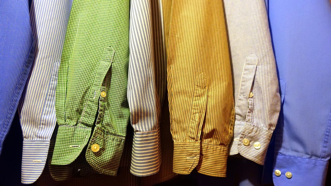 Shirts organised on a clothing rail