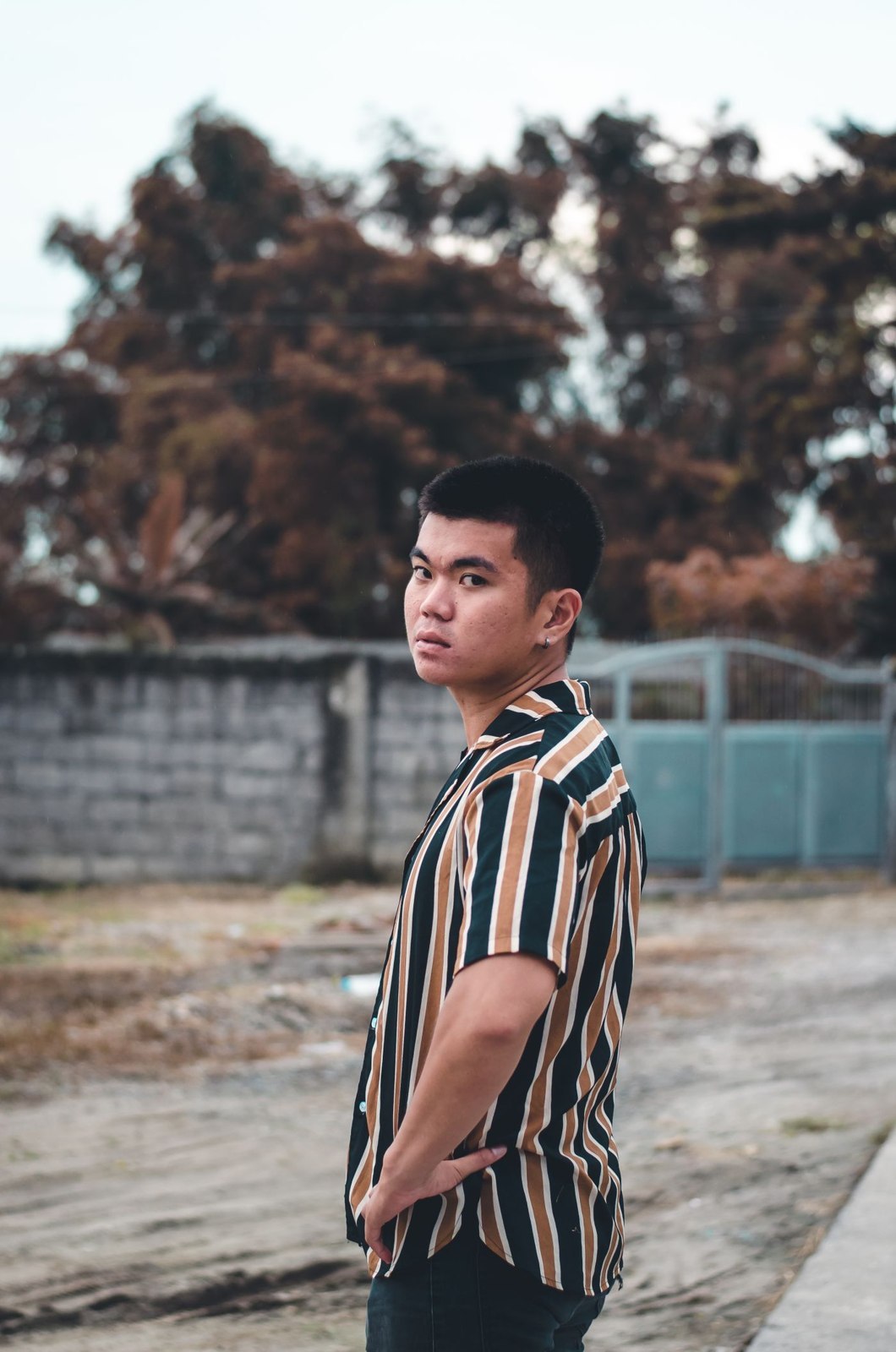 A striped shirt with plain dark trousers