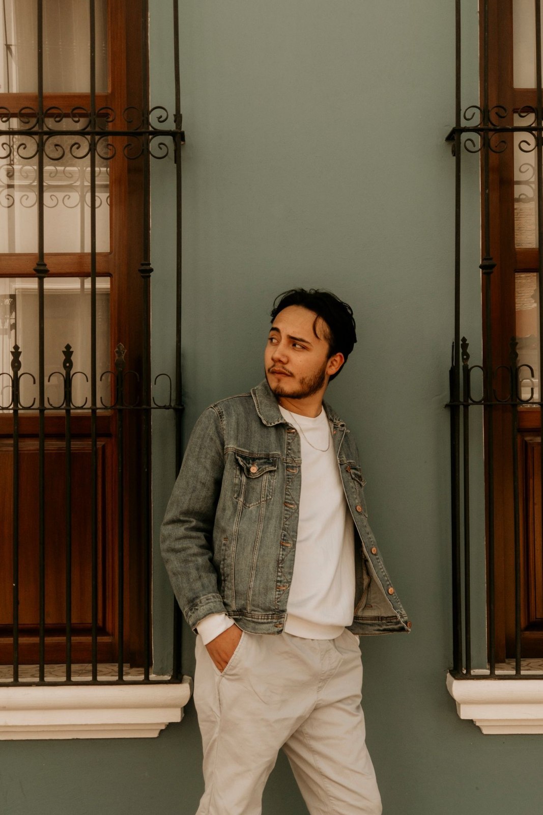 A light jacket layered over a white top