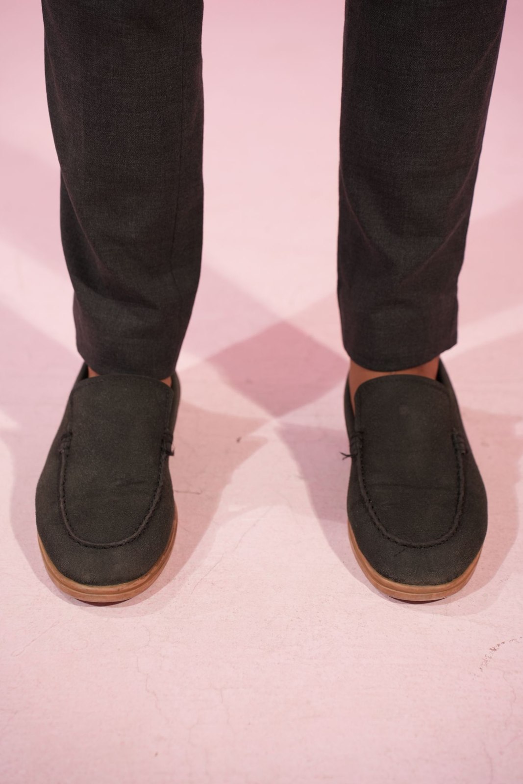 Dark trouser hems above loafers