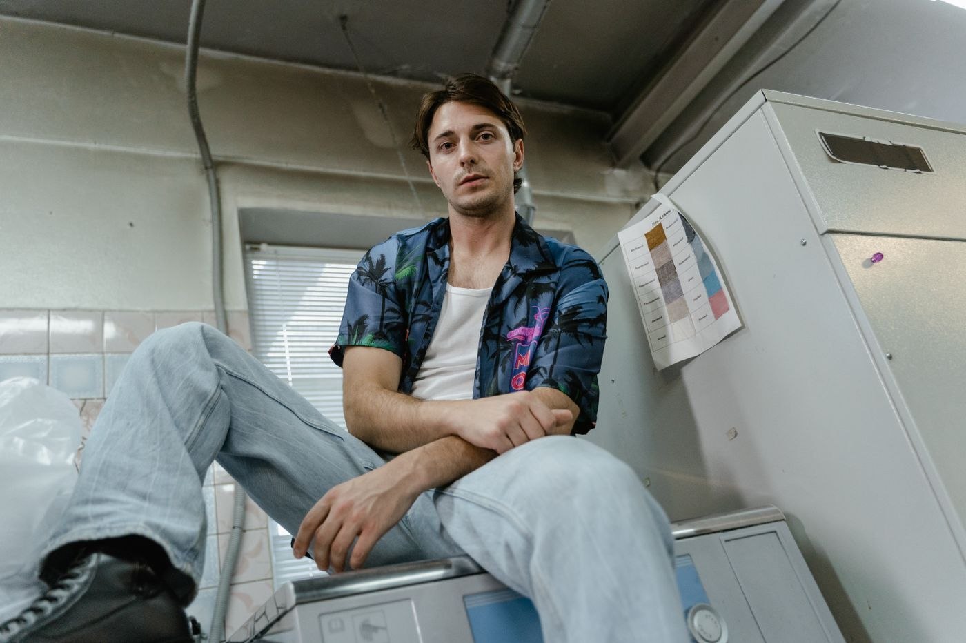 Denim clothing beside laundry machines