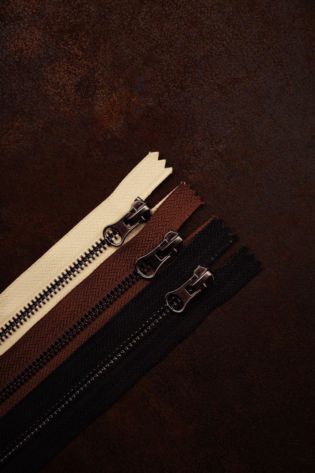 Three garment zips in different colours